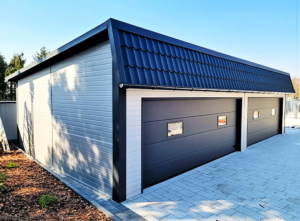 12x6m DELUX insulated workshop / warehouse / mobile garage with custom designed back sloping roof, 2 sectional doors, doors, 5 windows, cornices, guttering, plywood roof cladding, galvanized frame structure