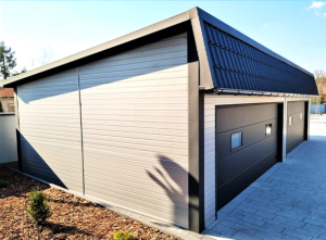 12x6m DELUX insulated workshop / warehouse / mobile garage with custom designed back sloping roof, 2 sectional doors, doors, 5 windows, cornices, guttering, plywood roof cladding, galvanized frame structure