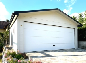 5,8×6m DELUX insulated mobile garage with gable roof, sectional door, door, 2 windows, cornices, gutter, galvanized frame