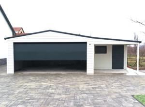 9x6m mobile garage lightweight garage with gable roof and sloping roof to the right, sectional door, door, window, skirting, horizontal cladding, guttering, galvanized frame