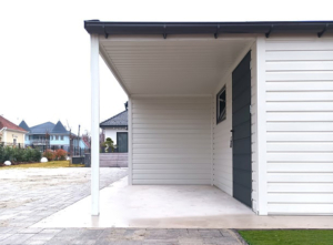 9x6m mobile garage lightweight garage with gable roof and sloping roof to the right, sectional door, door, window, skirting, horizontal cladding, guttering, galvanized frame