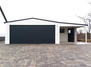 9x6m mobile garage lightweight garage with gable roof and sloping roof to the right, sectional door, door, window, skirting, horizontal cladding, guttering, galvanized frame