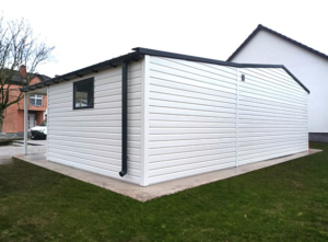 9x6m mobile garage lightweight garage with gable roof and sloping roof to the right, sectional door, door, window, skirting, horizontal cladding, guttering, galvanized frame