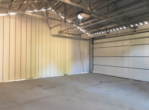 8,3x5,48m DELUX plastered mobile garage with inverted gable roof and side roof, sectional door, door, window, gutter, skirting, galvanized frame