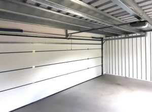 6x5,78m DELUX plastered mobile garage with back sloping roof, sectional door, door, window, gutter, skirting, galvanized frame