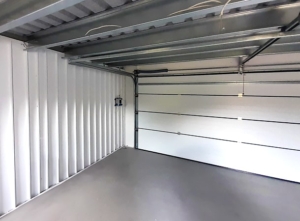 6x5,78m DELUX plastered mobile garage with back sloping roof, sectional door, door, window, gutter, skirting, galvanized frame