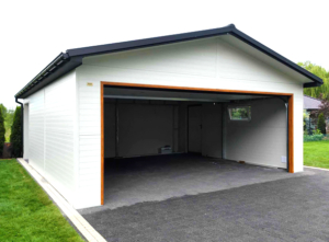 6x7,3m DELUX insulated mobile garage with gable roof, rear overhang, sectional door, door, window, skirting, gutter, galvanized frame