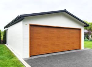 6x7,3m DELUX insulated mobile garage with gable roof, rear overhang, sectional door, door, window, skirting, gutter, galvanized frame