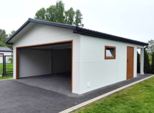 6x7,3m DELUX insulated mobile garage with gable roof, rear overhang, sectional door, door, window, skirting, gutter, galvanized frame