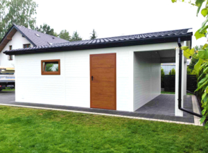 6x7,3m DELUX insulated mobile garage with gable roof, rear overhang, sectional door, door, window, skirting, gutter, galvanized frame