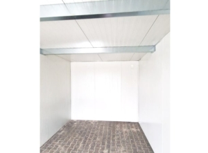 9,5x6,29m DELUX plastered insulated mobile garage with sloping roof, sectional door, 2 doors, 2 windows, partition and separate storage room, guttering, PIR sandwich panel wall and roof construction