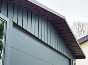6x6m quality mobile garage, with gable roof, felt cladding, anthracite grey walls, tilting door and door, 2 windows, cornices, guttering, horizontal cladding, galvanized frame