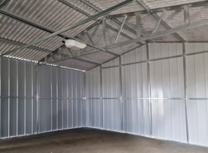 6x6m quality mobile garage, with gable roof, felt cladding, anthracite grey walls, tilting door and door, 2 windows, cornices, guttering, horizontal cladding, galvanized frame