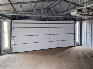 6x6m quality mobile garage, with gable roof, felt cladding, anthracite grey walls, tilting door and door, 2 windows, cornices, guttering, horizontal cladding, galvanized frame